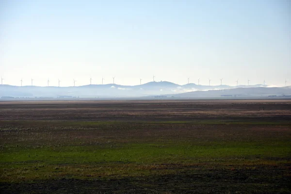 Rural wind farms at Lake George in Australia. View of huge wind turbines windmills. Lake George is an endorheic lake, as it has no outflow of water to rivers and oceans.