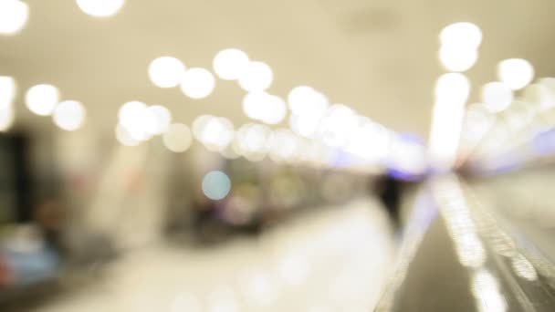 Moving staircase at airport - blurred abstract background — Stock Video