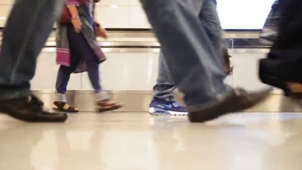 People walking with luggage in the international airport, close up shot of legs and shoes — Stock Video