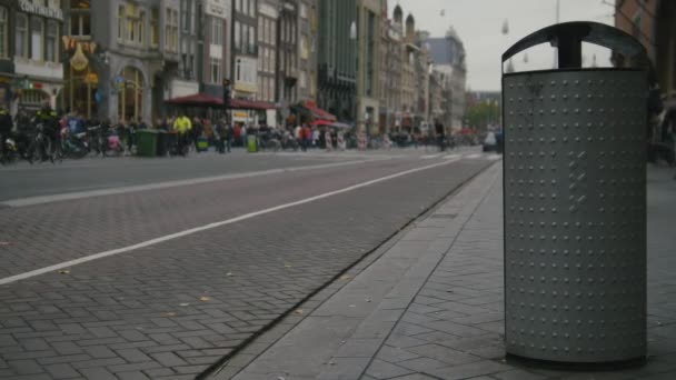 AMSTERDAM, NETHERLANDS -dustbin on street with the emblem of the city - triple x — Stock video