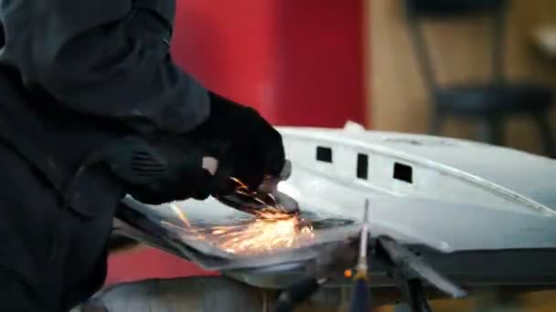 Professional car service - worker grinding metal construction with a circular saw, close up — Stock Video