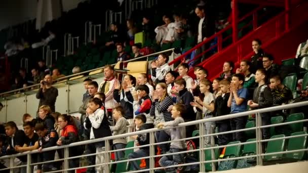 Kazan, Russia, 8 april 2017, Palace of single combats "Ak Bars" Kids karate competition WKF - spectators funs on the stands, slow-motion — Stock Video