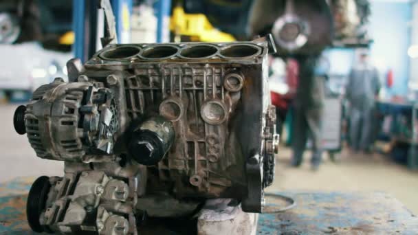 Car service - engine for repairing in vehicle workshop — Stock Video