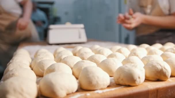 The chef prepares the dough for baking, raw dough on the Board — Stock Video