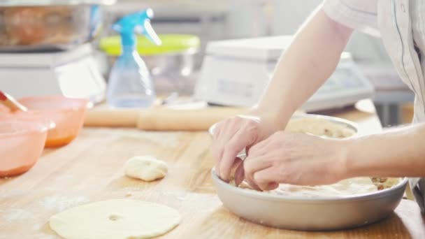 Cook is baking, forming and decorating meat pie in the bakery — Stock Video