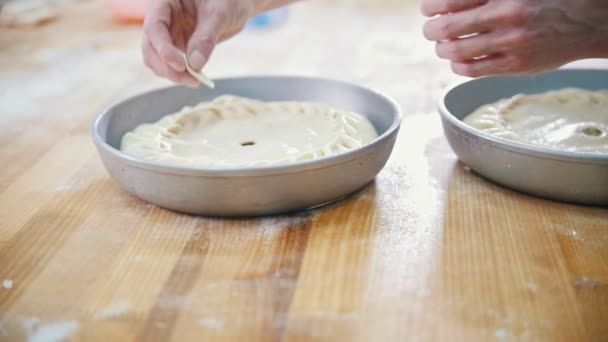 Cook is baking, forming and decorating pie in the bakery — Stock Video