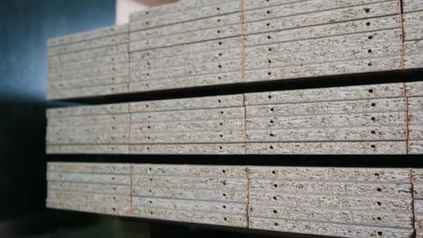 Stack of wood particleboard boards on the warehouse or factory — Stock Video