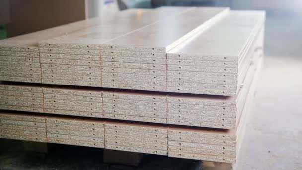 Stack of wood particleboard panels on the warehouse or factory — Stock Video