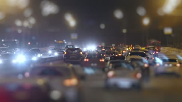 Tilt Shift shot of traffic on snow winter highway — Stock Video