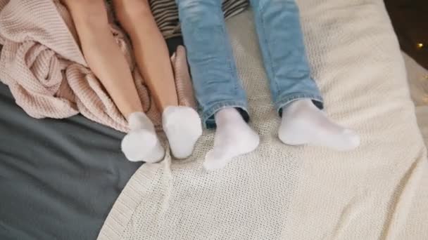 Legs of young attractive couple cuddling and waking up together, family relationships — Stock Video