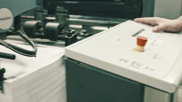 Printing process - feeding sheets of paper at polygraph industry, wide angle — Stock Video