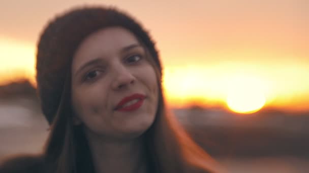 Portrait of attractive woman smiling with red lips at sunset — Stock Video