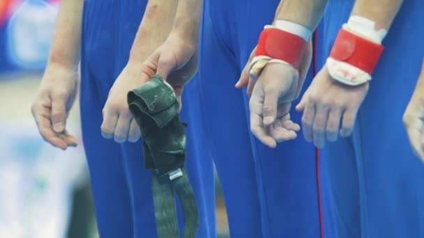 Hands of male particapants of gymnastic championship — Stock Video