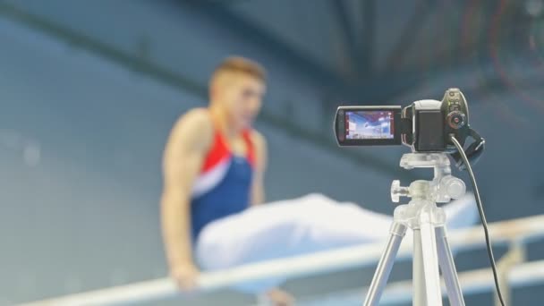 Fotos de la cámara competiciones gimnásticas - desenfocado — Vídeo de stock