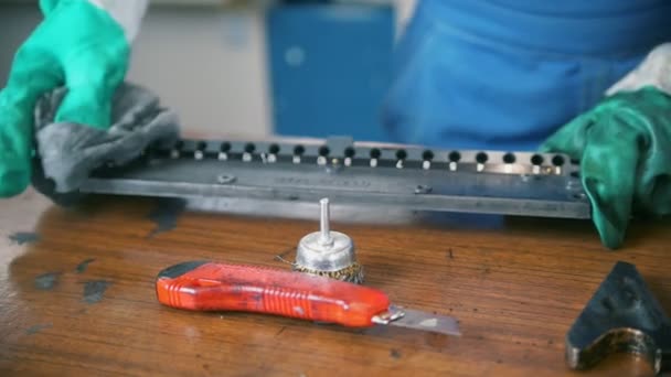 Worker in gloves clean a printing equipment in the typography — Stock Video