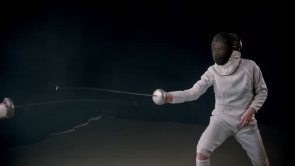 Fencing training - two women having a duel in the studio — Stock Video