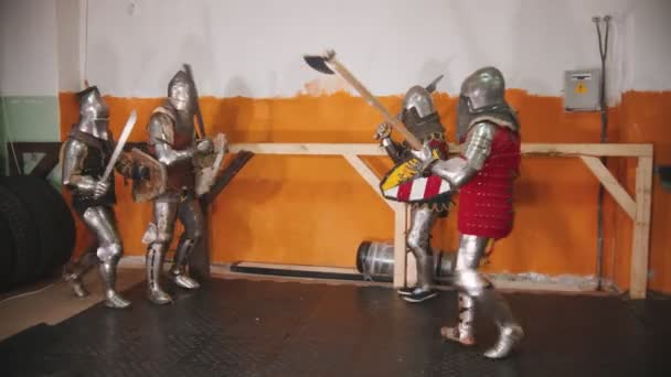 Four men knightes having a training fight — Stock Video