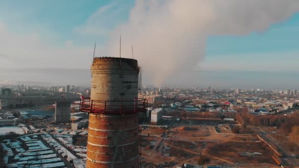 Air pollution - a big industrial pipe pollutes the air in the city - daylight — Stock Video