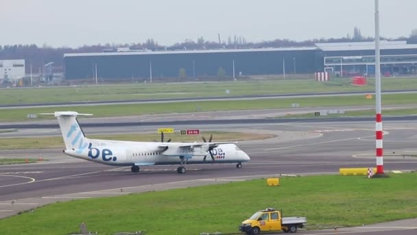 23-11-2019 NETHERLANDS, AMSTERDAM: - Airplane of FLYBE on the runway — Stock Video