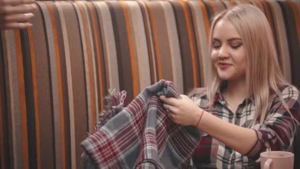 A waiter gives blanket to a young woman in the cafe — 비디오