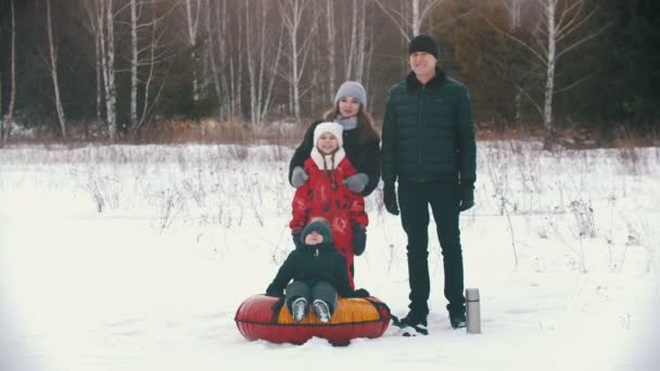 Family standing outdoors near the forest — Stok video