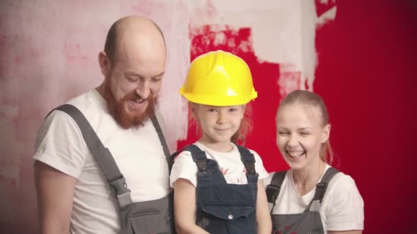 Happy family in overalls are smiling and looking at camera — 图库视频影像