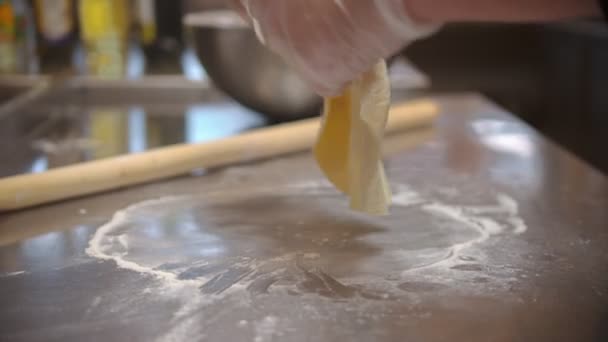 Restaurant kitchen - making a flat piece dough — Wideo stockowe