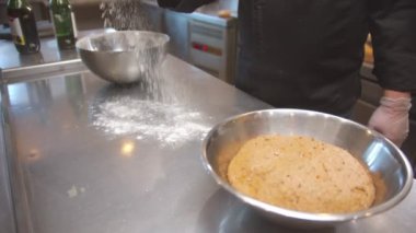 Chef making bread on the restaurant kitchen