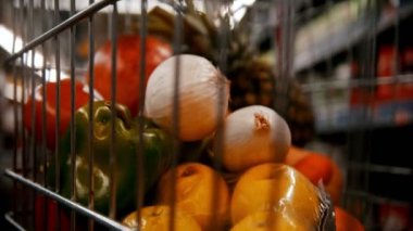 Shopping in the mall - vegetables fruits and other items in the trolley