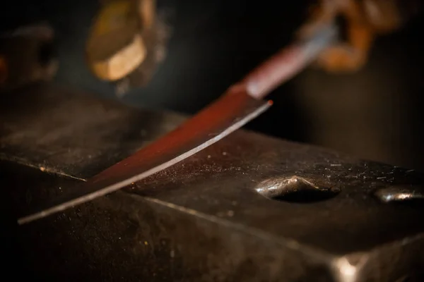 Forging a knife out of the metal