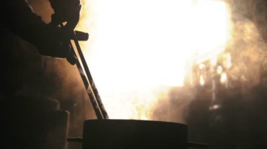 Steam comes off the hot blade after forging