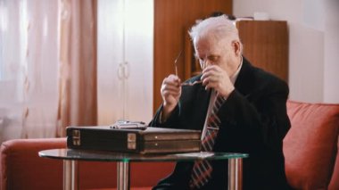 Elderly grandfather - old grandfather smugly crosses his arms over his chest