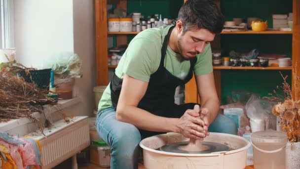 Pottery - the master is wetting the clay for better glide — Stock Video