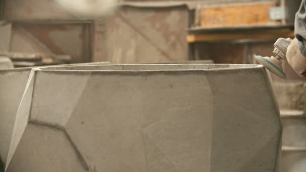 Concrete industry - polishing a big concrete figure with a grinder — Stock video