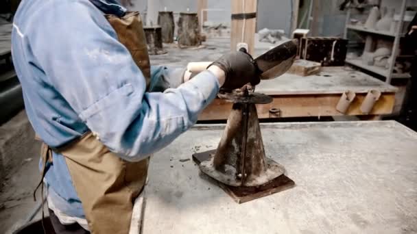 Concrete industry - worker putting concrete in the cone form and ramming it with vibrations — Stock Video