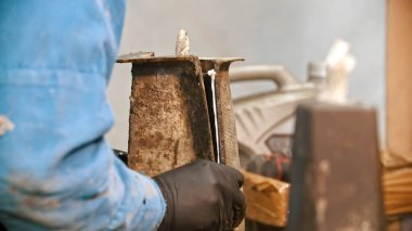 Concrete industry - man worker trying to connect two parts of one detail