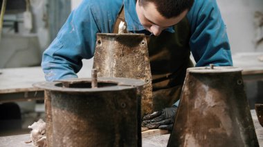 Concrete industry - man working with concrete details in the workshop