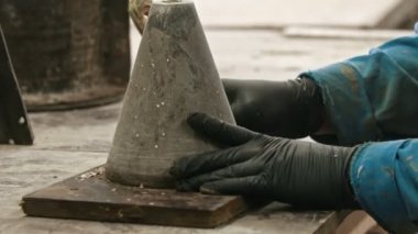 Concrete industry - a man working with a chisel