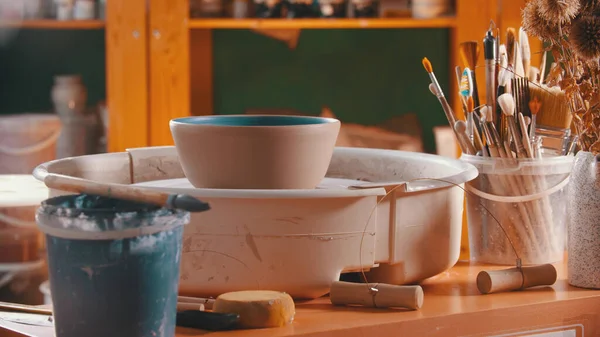 Pottery - clay bowl is rotating on a potters wheel — Stock Photo, Image