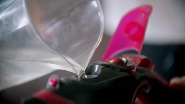 Filling an iron with water for steam ironing — Stock Footage Filling an iron with water for steam ironing Royalty Free Stock Footage
