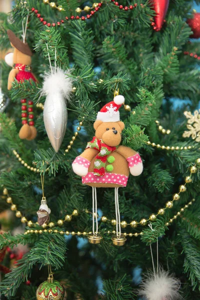 New Year. Bear on holiday tree