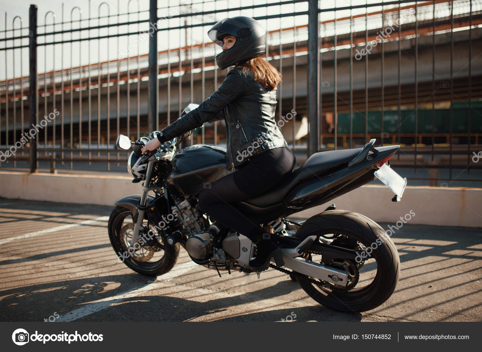 Cute young brunette woman and motorcycle Stock Photo by ©ToL_U4F 