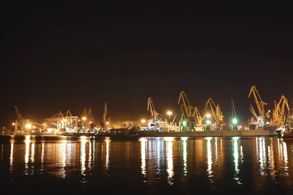 cargo ship moving load at port of Odessa. Night Time