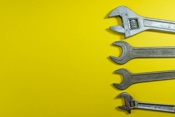 working tools. wrench for housework. colored background. tools for the house. steel reliable wand keys on a colored background. tools for manual worker