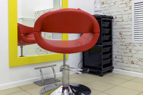 chair in the hair salon. a nice shade of a normal chair in front of a mirror