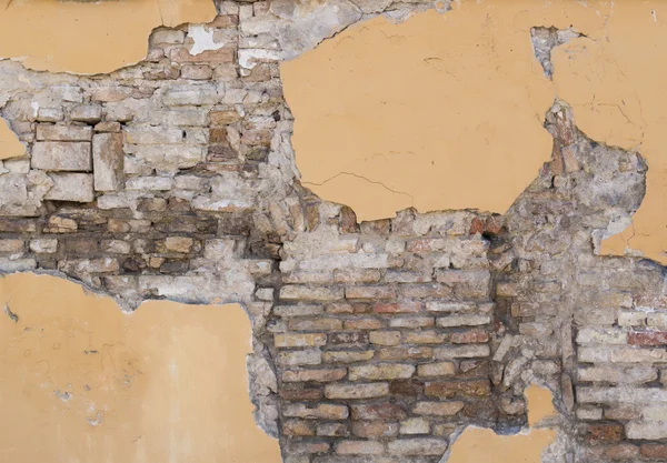 Background texture from brick wall with damaged cracked plaster — Stock Photo, Image