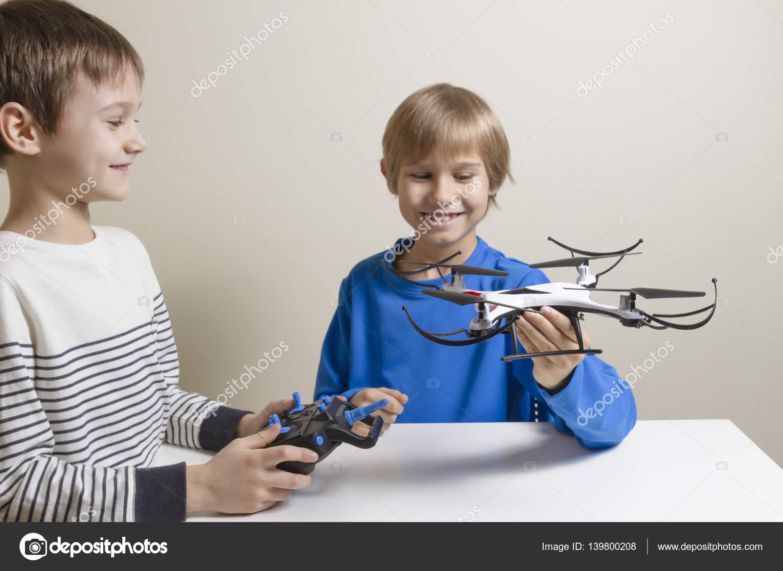 depositphotos_139800208-stock-photo-happy-kids-with-drone-at.jpg