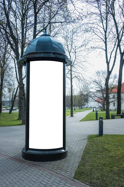 Advertising column mockup. Public information board in the street. — Stock Photo, Image