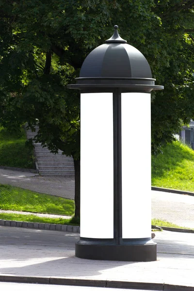 Mock up. Blank outdoor advertising column outdoors, public information board in the street. — Stock Photo, Image