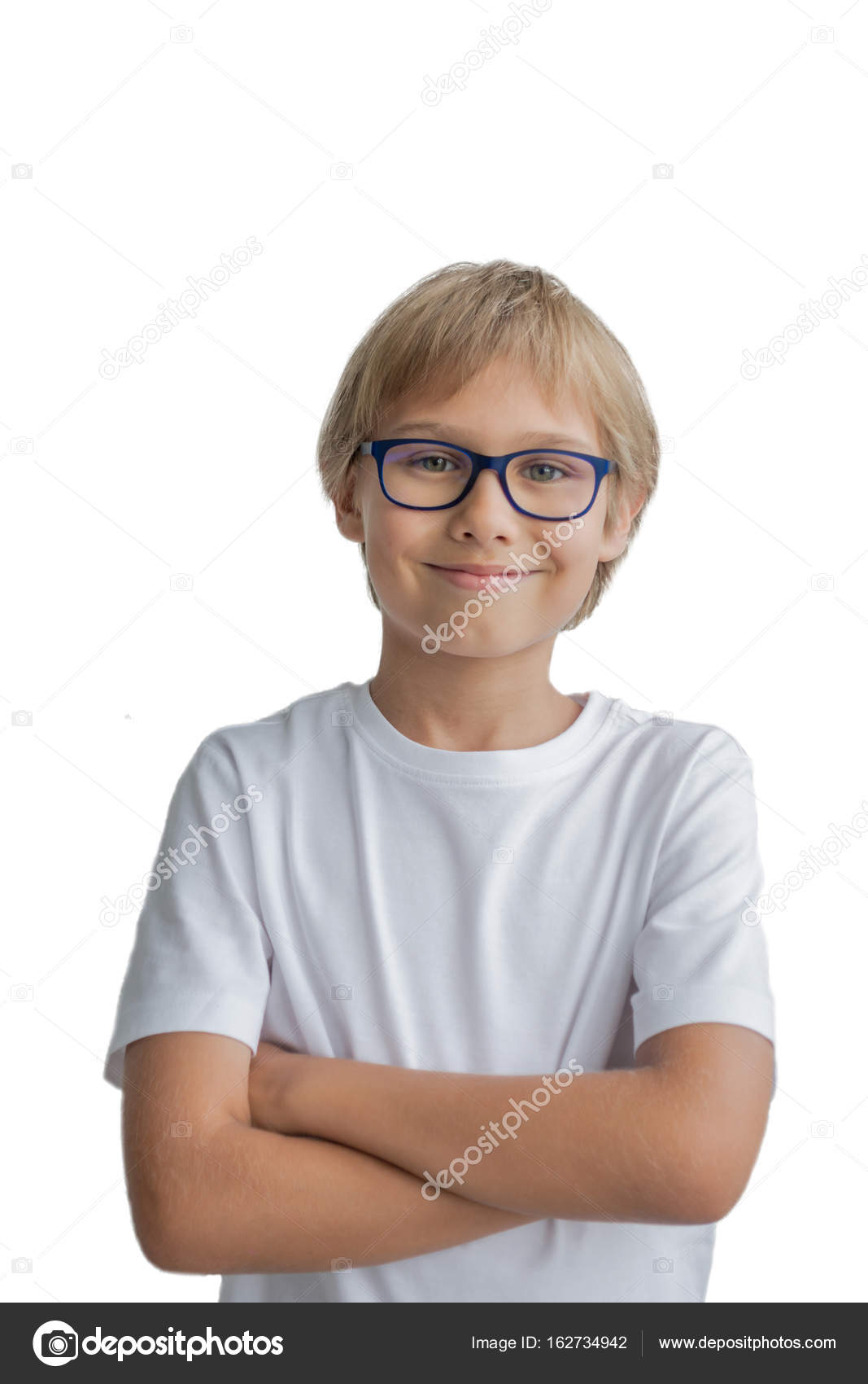 Smiling boy with crossed arms on white Portrait of